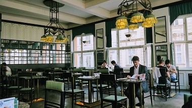 bar room with tall tables and customers