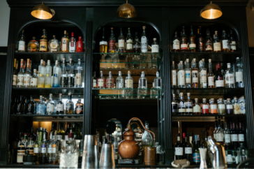 bottles on shelf at bar