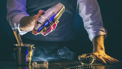 Bartender shaking a drink shaker