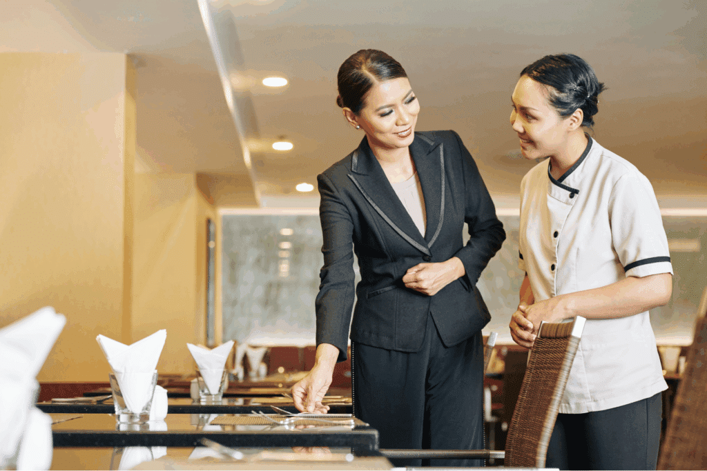 Restaurant owner collaborating with team to improve alcohol service training across venues like lounges and nightclubs