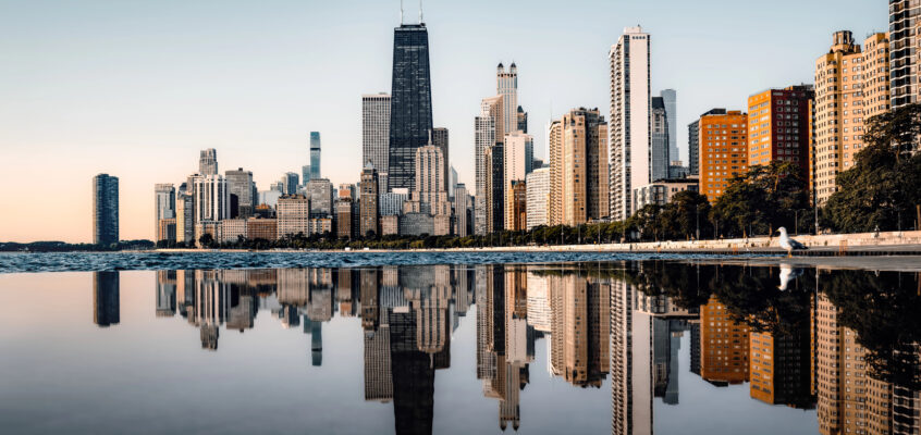 A high-contrast hero image featuring the Chicago skyline at twilight, with an official-looking overlay summarizing 2026 liquor codes and the new off-premise tax notice.
